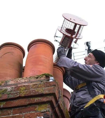 Photo of JBL Chimney Services replacing a chimney cowl in Surrey