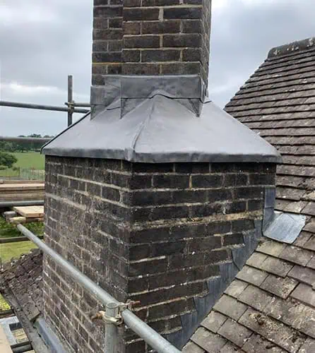 Photo of a chimney flashing repair on a decorative chimney in Surrey by JBL Chimney Services