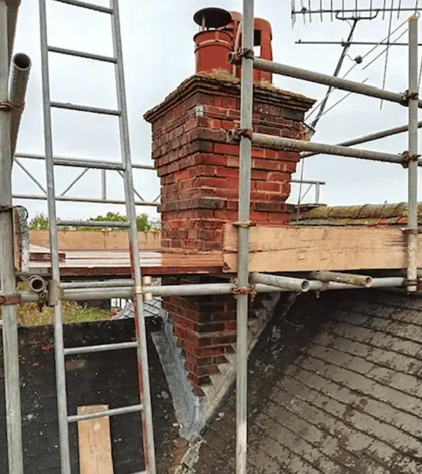 Photo showing a chimney leak being repaired on a Surrey home by JBL Chimney Services