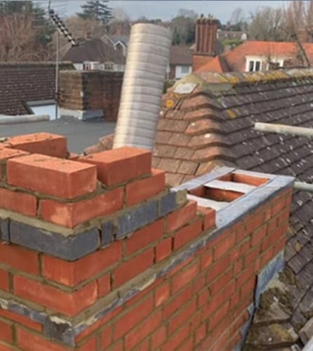 Photo of a chimney liner being installed on a Cranleigh&nbsp; home by JBL Chimney Services